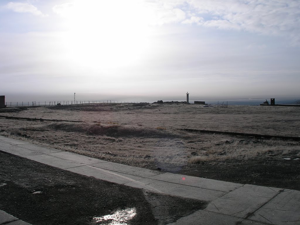 Polar sun over tundra and calibration masts, Norilsk Vega MS